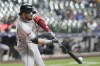 Arizona Diamondbacks' Eugenio Suárez hits a single during the fourth inning of a baseball game against the Milwaukee Brewers Thursday, Sept. 19, 2024, in Milwaukee. (AP Photo/Morry Gash)