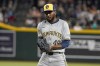 Milwaukee Brewers pitcher Enoli Paredes celebrates after a win over the Arizona Diamondbacks in a baseball game, Saturday, Sept. 14, 2024, in Phoenix. (AP Photo/Darryl Webb)
