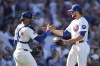 Chicago Cubs catcher Christian Bethancourt, left, and relief pitcher Porter Hodge, right, celebrate their win over the Washington Nationals in a baseball game Friday, Sept. 20, 2024, in Chicago. (AP Photo/Charles Rex Arbogast)