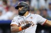 San Francisco Giants' Heliot Ramos watches his RBI single during the first inning of a baseball game against the Kansas City Royals Friday, Sept. 20, 2024, in Kansas City, Mo. (AP Photo/Charlie Riedel)
