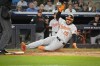 Baltimore Orioles' Anthony Santander scores a run off a single from Ryan O'Hearn during the forth inning of a baseball game against the New York Yankees, Tuesday, Sept. 24, 2024, in New York. (AP Photo/Bryan Woolston)