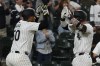 Chicago White Sox's Korey Lee, right, is greeted by Lenyn Sosa, left, after hitting a two-run home run against the Los Angeles Angels during second inning of a baseball game, Wednesday, Sept. 25, 2024, in Chicago. (AP Photo/David Banks)