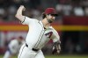 Arizona Diamondbacks starting pitcher Zac Gallen throws against the San Francisco Giants during the first inning of a baseball game Wednesday, Sept. 25, 2024, in Phoenix. (AP Photo/Ross D. Franklin)