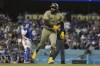 San Diego Padres' Fernando Tatis Jr. celebrates after hitting a home run during the fifth inning of a baseball game against the Los Angeles Dodgers in Los Angeles, Wednesday, Sept. 25, 2024. (AP Photo/Ashley Landis)