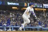Los Angeles Dodgers' Will Smith watches his two-run home run during the seventh inning of a baseball game against the San Diego Padres, Thursday, Sept. 26, 2024, in Los Angeles. (AP Photo/Mark J. Terrill)