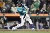 Seattle Mariners' Justin Turner hits an RBI single during the 10th inning against the Oakland Athletics to win 7-6 in a baseball game, Saturday, Sept. 28, 2024, in Seattle. (AP Photo/John Froschauer)