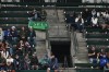 Fans sit near a 