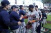 Detroit Tigers' Andy Ibanez (77) celebrates with the team and staff after their 5-2 win against the Houston Astros in Game 2 of an AL Wild Card Series baseball game Wednesday, Oct. 2, 2024, in Houston. (AP Photo/Kevin M. Cox)