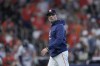 Houston Astros manager Joe Espada walks back to the dugout after making a pitching change int he sixth inning of Game 2 of an AL Wild Card Series baseball game against the Detroit Tigers Wednesday, Oct. 2, 2024, in Houston. (AP Photo/Kevin M. Cox)