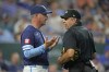 Kansas City Royals manager Matt Quatraro talks to home plate umpire James Hoye during the sixth inning of a baseball game against the San Francisco Giants Friday, Sept. 20, 2024, in Kansas City, Mo. (AP Photo/Charlie Riedel)
