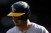 Oakland Athletics designated hitter Brent Rooker walks to the dugout after striking out against the Seattle Mariners during the first inning of a baseball game, Sunday, Sept. 29, 2024, in Seattle. (AP Photo/Lindsey Wasson)