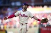 Philadelphia Phillies first base Bryce Harper talks with an umpire during the fourth inning of Game 1 of a baseball NL Division Series against the New York Mets, Saturday, Oct. 5, 2024, in Philadelphia. (AP Photo/Matt Slocum)