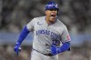 Kansas City Royals' Salvador Perez (13) reacts after hitting a solo home run against the New York Yankees during the fourth inning of Game 2 of the American League baseball playoff series, Monday, Oct. 7, 2024, in New York. (AP Photo/Seth Wenig)