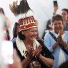 Wearing a ceremonial headress, Assembly of Manitoba Chiefs Grand Chief Cathy Merrick takes her oath of office following her first-ballot victory for the position on Wednesday afternoon during the 36th Annual General Assembly that was held on Waywayseecappo First Nation land near Brandon. (Matt Goerzen/The Brandon Sun)