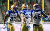 Winnipeg Blue Bombers defensive back Brandon Alexander (37), linebacker Tony Jones (33), and defensive lineman Celestin Haba (45) celebrate after preventing Saskatchewan Roughriders from scoring a two-point conversion during the second half of CFL football action in Regina, on Sunday, September 1, 2024. (Heywood Yu / The Canadian Press)