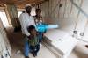 MIKE DEAL / FREE PRESS
                                Workeabeba Asfaw and Addis Aboye with their son, Eyoab, 5, inside their almost completed home. &lsquo;Having a home means everything,&rsquo; says Asfaw.