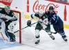 JOHN WOODS / THE CANADIAN PRESS
                                Winnipeg&rsquo;s Nikita Chibrikov (90) and Minnesota&rsquo;s Carson Lambos (71) chase a loose puck during the second period Saturday.