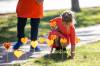 MIKAELA MACKENZIE / FREE PRESS 	 Grade two student Ivy places orange hearts along the walkway project at cole Van Walleghem School Thursday, Sept. 26, 2024. For Maggie story. Winnipeg Free Press 2024