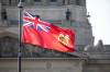 MIKAELA MACKENZIE / FREE PRESS FILES
                                The Manitoba flag flies in front of the Manitoba Legislative Building