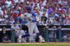 New York Mets' Francisco Lindor hits a single against Philadelphia Phillies pitcher Cristopher Sánchez during the third inning of Game 2 of a baseball NL Division Series, Sunday, Oct. 6, 2024, in Philadelphia. (AP Photo/Matt Slocum)