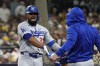 Los Angeles Dodgers' Teoscar Hernández gets sunflowers seeds to the face after hitting a grand slam during the third inning in Game 3 of a baseball NL Division Series against the San Diego Padres, Tuesday, Oct. 8, 2024, in San Diego. (AP Photo/Gregory Bull)
