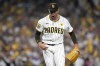 San Diego Padres relief pitcher Jason Adam reacts after striking out Los Angeles Dodgers' Andy Pages during the seventh inning in Game 3 of a baseball NL Division Series Tuesday, Oct. 8, 2024, in San Diego. (AP Photo/Ashley Landis)