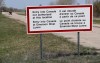 Mounties in Manitoba say they have charged a man with human smuggling and arrested six people at the Canada-U.S. border. A sign is seen near the border near Emerson, Man., Friday, May 5, 2017. THE CANADIAN PRESS/Trevor Hagan