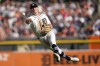 Detroit Tigers shortstop Trey Sweeney throws errantly to first base on a single by Cleveland Guardians' Steven Kwan in the third inning during Game 3 of a baseball American League Division Series, Wednesday, Oct. 9, 2024, in Detroit. (AP Photo/Paul Sancya)