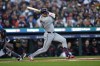 Cleveland Guardians' Lane Thomas hits an RBI single to score teammate Steven Kwan in the first inning during Game 4 of a baseball American League Division Series against the Detroit Tigers, Thursday, Oct. 10, 2024, in Detroit. (AP Photo/Paul Sancya)