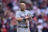 Detroit Tigers' Spencer Torkelson takes off his batting gloves after striking out in the seventh inning during Game 5 of baseball's American League Division Series against the Cleveland Guardians, Saturday, Oct. 12, 2024, in Cleveland. (AP Photo/David Dermer)