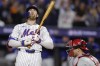 New York Mets' Brandon Nimmo reacts after striking out against the Philadelphia Phillies with runners on base during the fifth inning of Game 4 of the National League baseball playoff series, Wednesday, Oct. 9, 2024, in New York. (AP Photo/Adam Hunger)