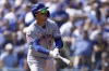 New York Mets' Mark Vientos watches his grand slam home run against the Los Angeles Dodgers during the second inning in Game 2 of a baseball NL Championship Series, Monday, Oct. 14, 2024, in Los Angeles. (AP Photo/Ashley Landis)