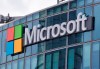 FILE - This April 12, 2016, file photo shows the Microsoft logo in Issy-les-Moulineaux, outside Paris, France. Russia, China and Iran are expanding their partnerships with cyber criminals to conduct cyberespionage and cyberattacks against the U.S. and other nations, according to a new report from Microsoft. Analysts at the tech giant say partnerships between authoritarian governments and criminal networks have benefits for both sides, increasing the volume and effectiveness of the cyber operations while giving criminals new avenues to profit and protection from prosecution. (AP Photo/Michel Euler, File)