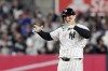 New York Yankees' Anthony Rizzo celebrates after hitting a RBI double against the Cleveland Guardians during the sixth inning in Game 2 of the baseball AL Championship Series Tuesday, Oct. 15, 2024, in New York. (AP Photo/Godofredo Vásquez)