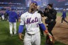 New York Mets shortstop Francisco Lindor (12) celebrates after the New York Mets beat the Philadelphia Phillies in Game 4 of the National League baseball playoff series, Wednesday, Oct. 9, 2024, in New York. (AP Photo/Adam Hunger)