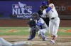 New York Mets' Starling Marte hits a RBI-single against the Los Angeles Dodgers during the eighth inning in Game 5 of a baseball NL Championship Series, Friday, Oct. 18, 2024, in New York. (AP Photo/Adam Hunger)