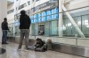 People wait for the arrival of a flight at Pearson Airport in Mississauga, Ont., Tuesday, March 14, 2023. THE CANADIAN PRESS/Chris Young