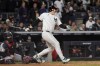 New York Yankees' Anthony Rizzo watches his RBI double against the Cleveland Guardians during the sixth inning in Game 2 of the baseball AL Championship Series Tuesday, Oct. 15, 2024, in New York. (AP Photo/Godofredo Vásquez )