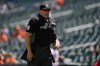 FILE - Home plate umpire Mark Carlson looks on during the first inning of a baseball game between the Baltimore Orioles and the Kansas City Royals, Monday, May 9, 2022, in Baltimore. (AP Photo/Julio Cortez, File)