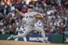 New York Yankees starting pitcher Clarke Schmidt throws against the Cleveland Guardians during the first inning in Game 3 of the baseball AL Championship Series Thursday, Oct. 17, 2024, in Cleveland.(AP Photo/Jeff Roberson)