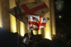 Demonstrators wave Georgian national flags during an opposition protest against the results of the parliamentary election in Tbilisi, Georgia, on Monday, Oct. 28, 2024. (AP Photo/Zurab Tsertsvadze)