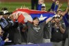 Los Angeles Dodgers' Kiké Hernández, center, celebrates with teammates after the Dodgers beat the New York Yankees in Game 5 to win the baseball World Series, Thursday, Oct. 31, 2024, in New York. (AP Photo/Seth Wenig)