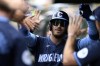 FILE- Chicago Cubs' Cody Bellinger (24) celebrates with teammates in the dugout after hitting a two-run home run during the first inning of a baseball game against the Toronto Blue Jays in Chicago, Friday, Aug. 16, 2024. (AP Photo/Paul Beaty, File)