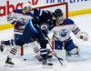 JOHN WOODS / THE CANADIAN PRESS FILES
                                Jets captain Adam Lowry crowds the front of the Edmonton Oilers net and goaltender Stuart Skinner during action between the teams last season.