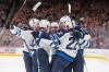 Amber Bracken / THE CANADIAN PRESS
                                Adam Lowry (right) celebrates with his teammates after opening the scoring Wednesday in the Jets&rsquo; season-opening 6-0 victory over the Edmonton Oilers in Edmonton.
