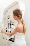 BREAST CANCER SOCIETY OF CANADA A woman prepares to receive a mammogram.