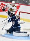 Fred Greenslade / THE CANADIAN PRESS
                                Connor Hellebuyck made 26 saves against the Chicago Blackhawks.