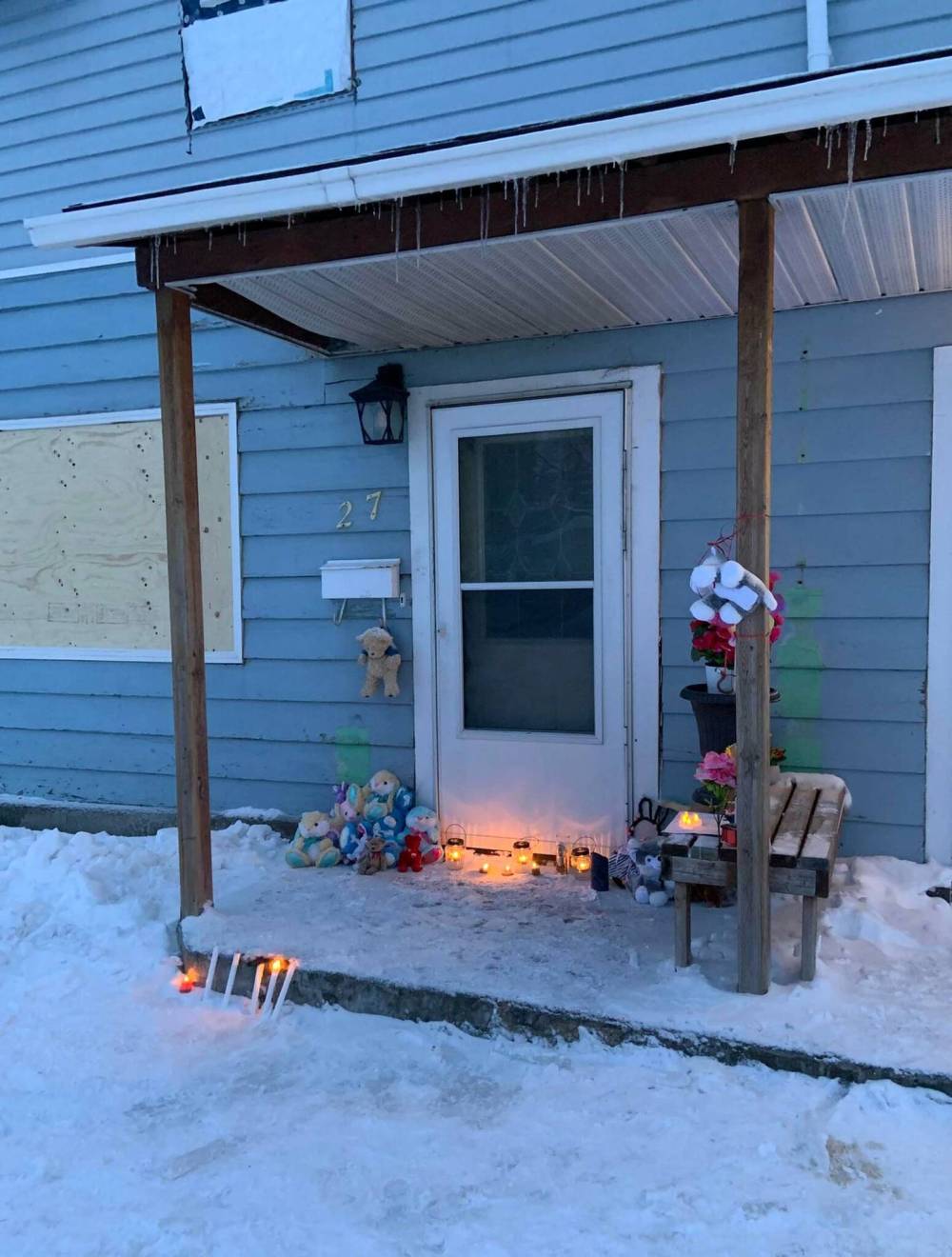 KINDRA STOTHERS PHOTO
                                Mourners gathered in 2022 for a candlelight vigil outside the Portage la Prairie duplex where the Shantelle Murphy and her two children were killed.