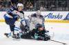 Lindsey Wasson / The Associated Press
                                Winnipeg Jets defenceman Logan Stanley and goaltender Connor Hellebuyck keep the puck and Seattle Kraken centreman Jaden Schwartz out of the goal during the second period Thursday in Seattle.