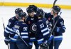 Winnipeg Jets' Jaret Anderson-Dolan (28), Nikita Chibrikov (90), Simon Lundmark (42), Brad Lambert (93) and Elias Salomonsson (57) celebrate Lundmark's goal against the  Calgary Flames during third period NHL pre-season game action in Winnipeg on Wednesday, October 2, 2024. THE CANADIAN PRESS/John Woods